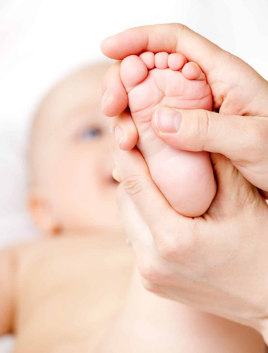 Close-up of a baby's foot being massaged